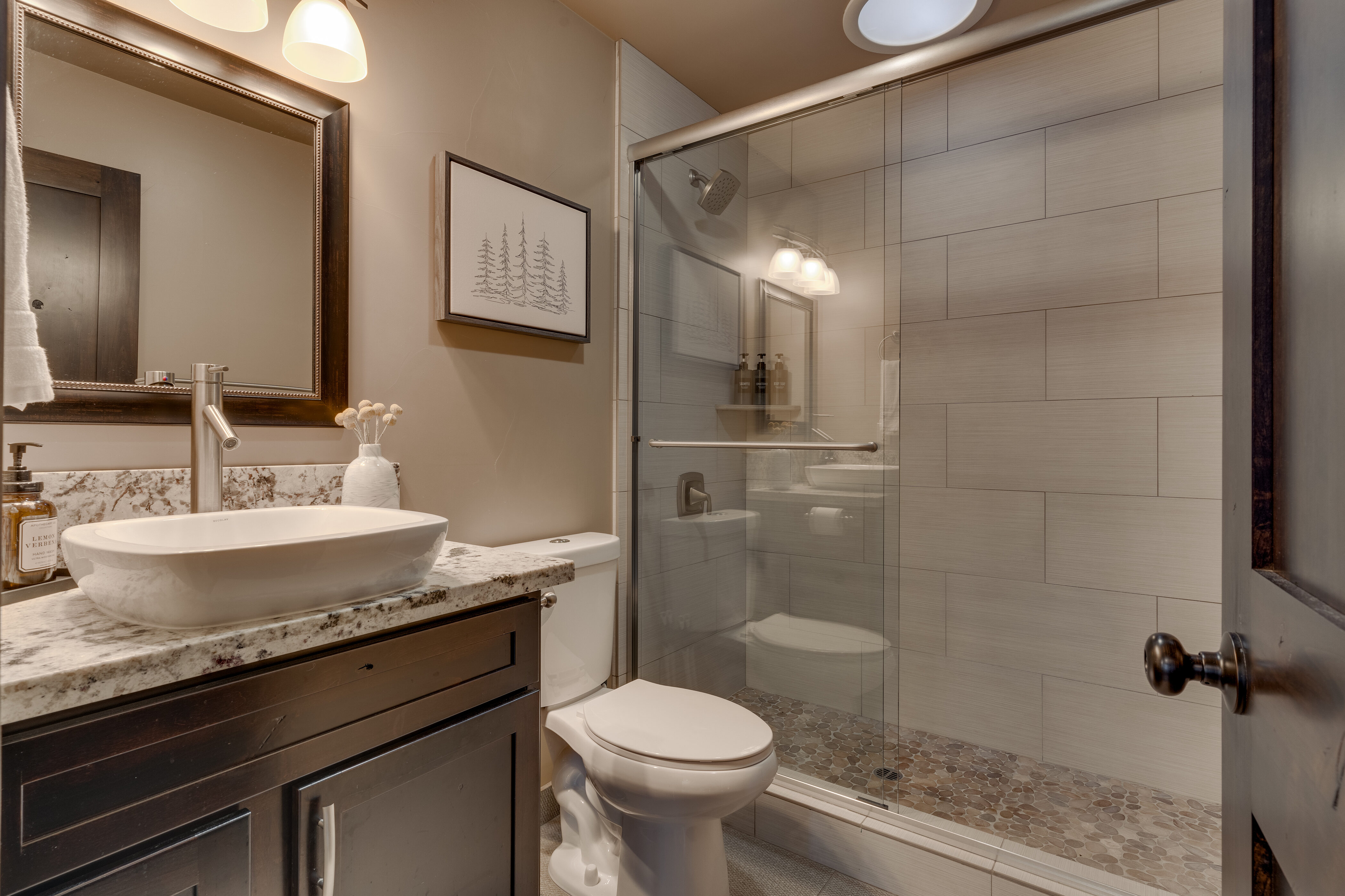 Bathroom with glass enclosed shower Bathroom with glass enclosed shower