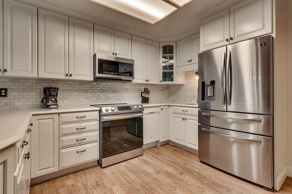 Kitchen area with stainless-steel appliance