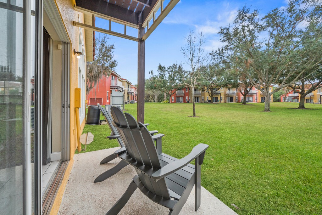 - Private patio with Adirondack chairs overlooking a peaceful green landscape - Savor your morning coffee or unwind with a glass of wine surrounded by tranquil scenery - Experience the perfect blend of outdoor relaxation and vibrant community charm