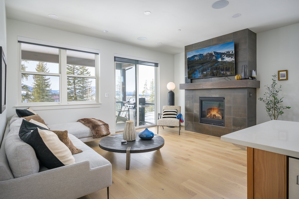 Living Area with 65" Smart TV and Gas Fireplace