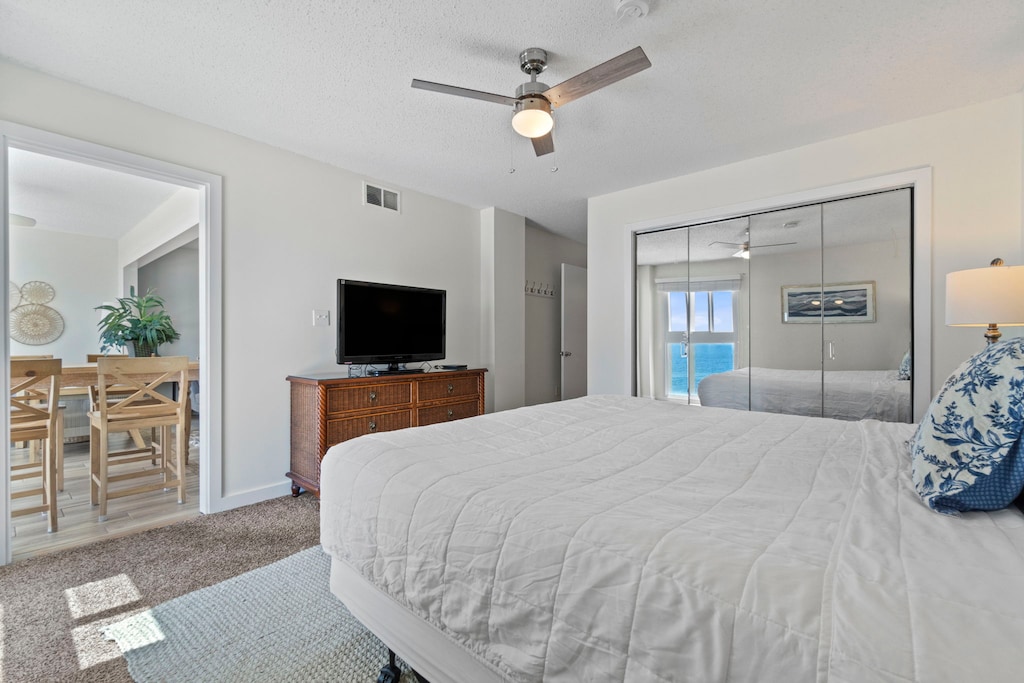 Flat-screen TV in the primary bedroom