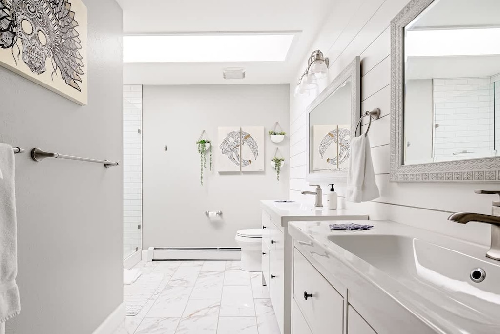 Large en suite bathroom with skylight