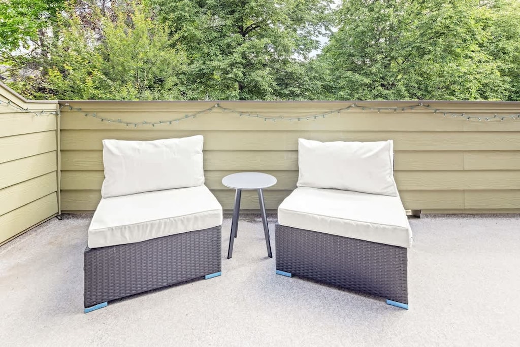 Balcony with table and two chairs