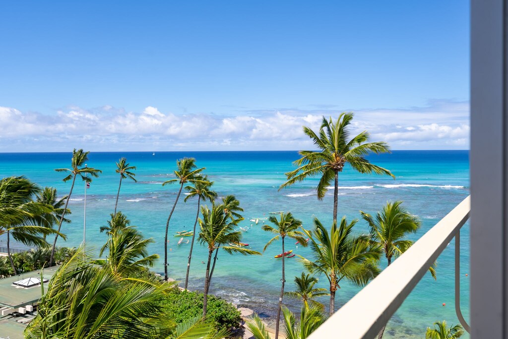 Relaxing balcony offering expansive tropical views for a serene and exclusive getaway.