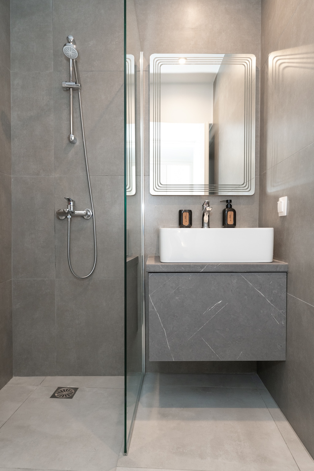 The bathroom includes a refreshing rain shower for relaxing after a day of exploration.