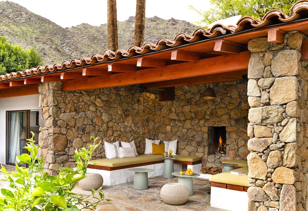 Gather around the stone fireplace