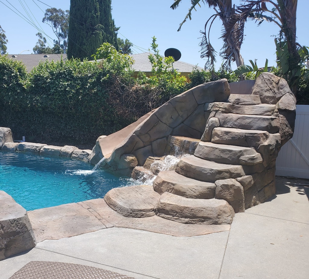 Renovated pool and rockslide.