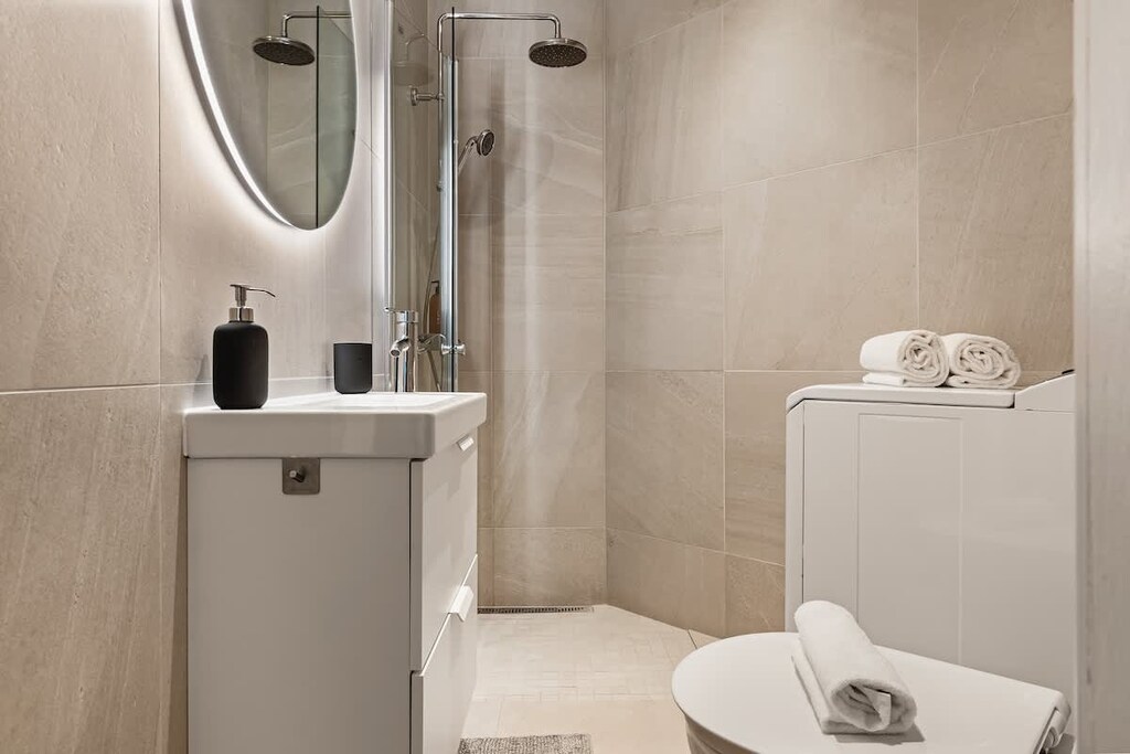 Small but with great features:
- Rain shower
- Heated flooring
- Washing machine
- LED mirror ☞ making it easy to get ready for your day or night out!