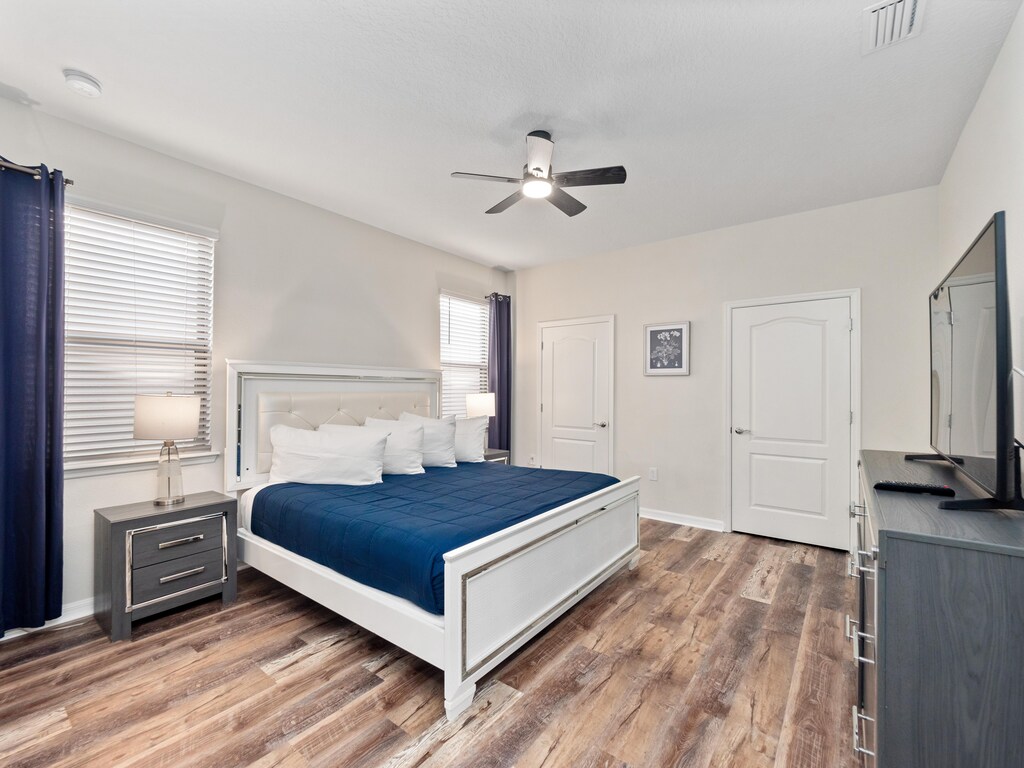 Bedroom 2 Downstairs King Bedroom Ensuite Bathroom Walk in Shower separate tub Sleeps 2 Blue & White
