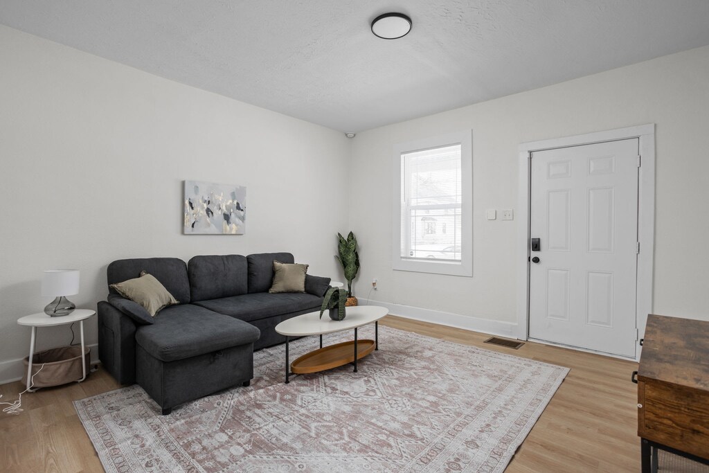 Living Room: Bright and airy space with modern decor, perfect for relaxing or entertaining!