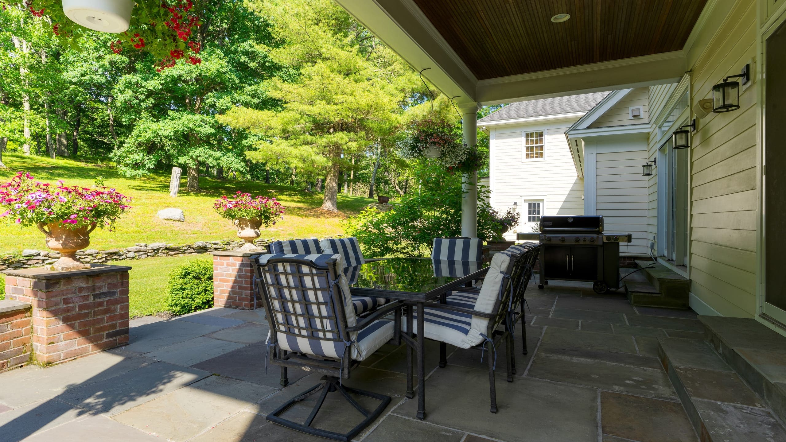 Multiple outdoor spaces - features al fresco dining and BBQ grill.
