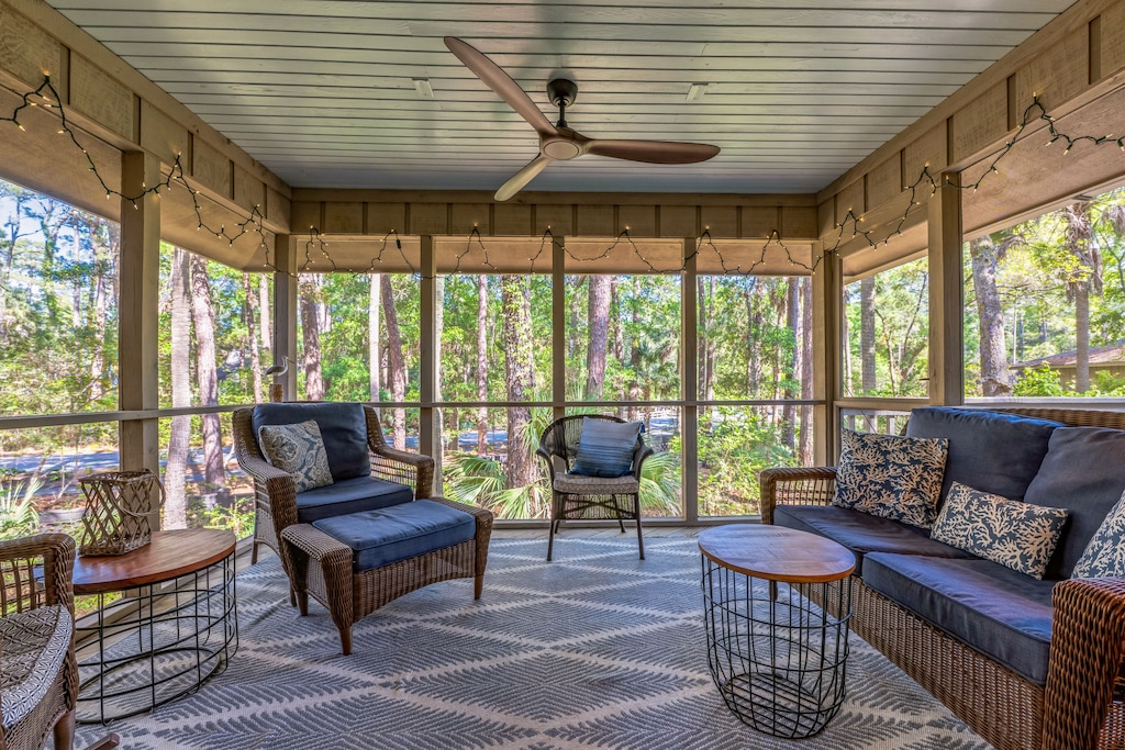 Screened in porch with fan and plenty of seating