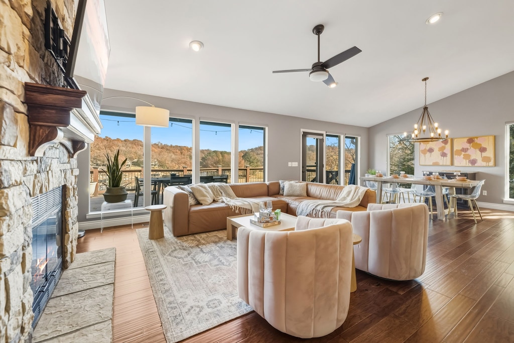 Enjoy two living areas with tons of cozy seating, a fully stocked kitchen, a ping pong table, and large windows with sweeping views of the Ozark Mountains and the lake.
