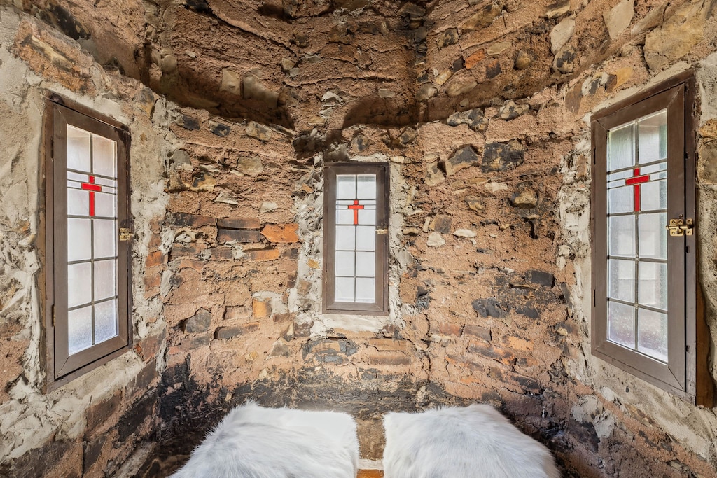Step back in time with this intimate stone alcove – a cozy nook for quiet reflection or reading.