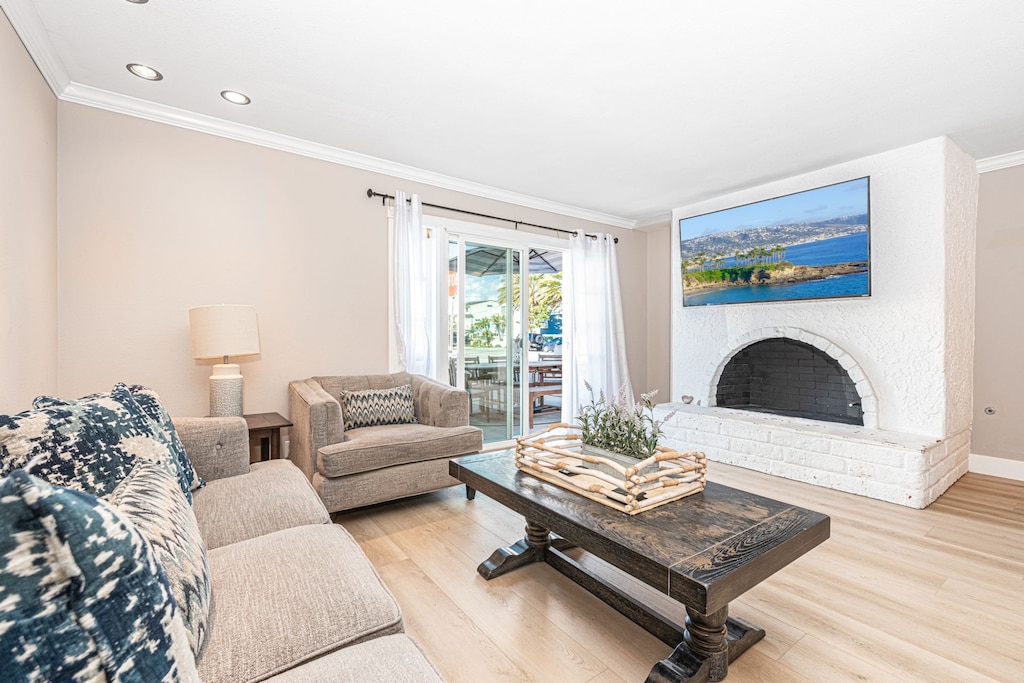 The main living area has plenty of space for the whole group to stretch out, with a sofa and love seat, smart TV, and dining table with seating for 6.