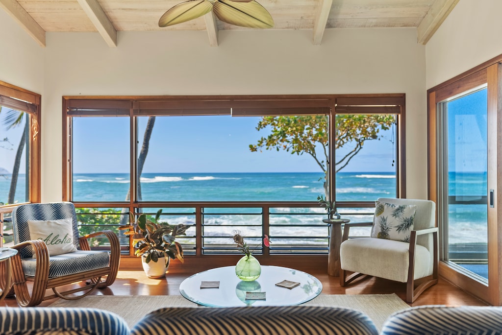 Unwind in the living room with panoramic ocean views and plenty of natural light.