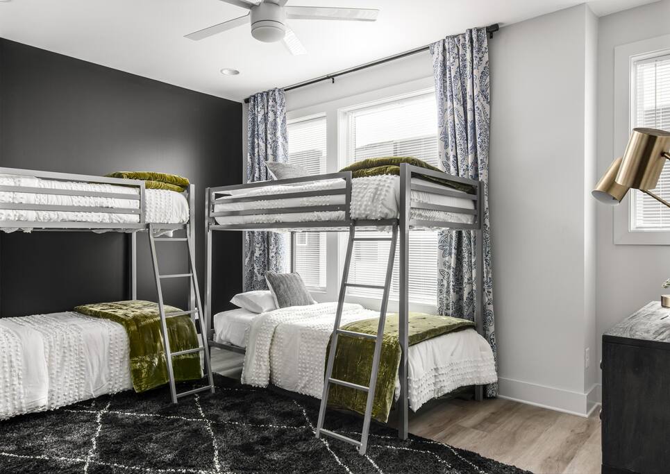 Bunk master bedroom with 4 single beds.  Attached bathroom with double sink vanity