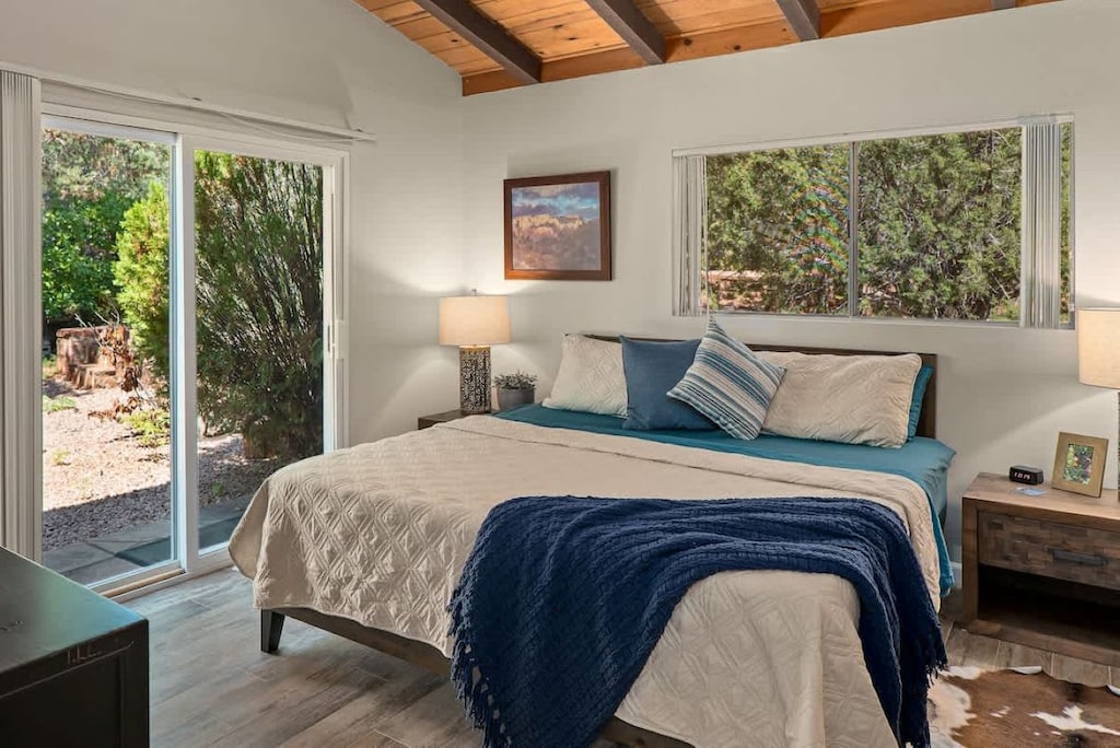 Master bedroom with king bed and access to back yard.