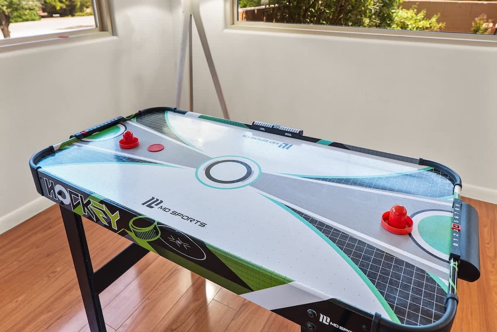 Game on! Air hockey table for family fun.
