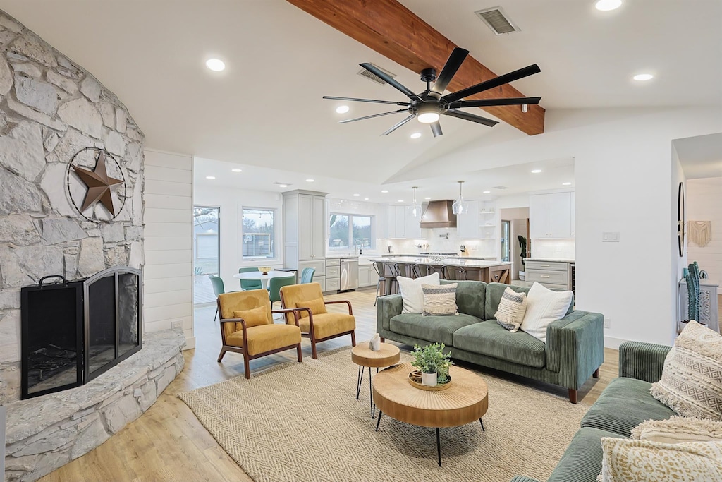 With vaulted ceilings and rustic finishes, this elegant living room has been outfitted with comfortable couches, a designer rug, and southern décor to provide you with all the comforts of home.