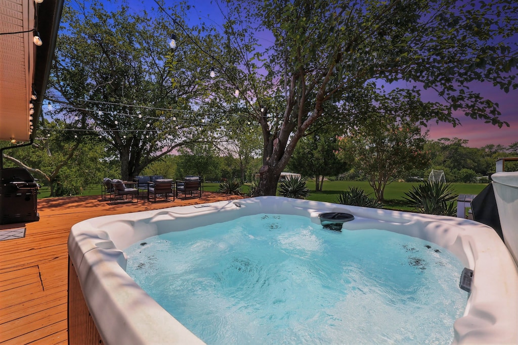 Slip into the warm waters of this hot tub and let the stress of your daily life ease away. Take in the scenic country views under the warm glow of the twinkling string lights.