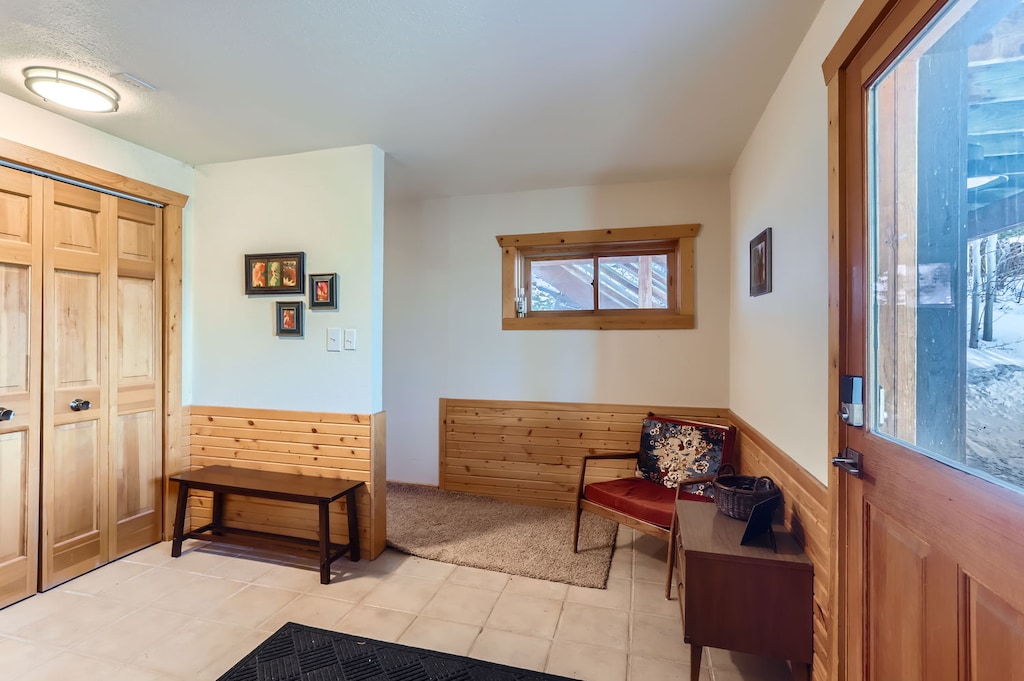 Welcoming Entrance - Ground Floor Entryway Leading to the Garage and Main Floor Stairs
