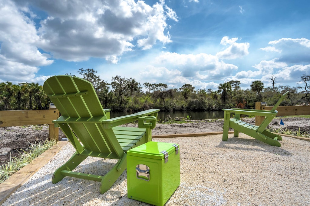 Unwind in these Adirondack chairs with a refreshing drink from the cooler, surrounded by serene nature views.
