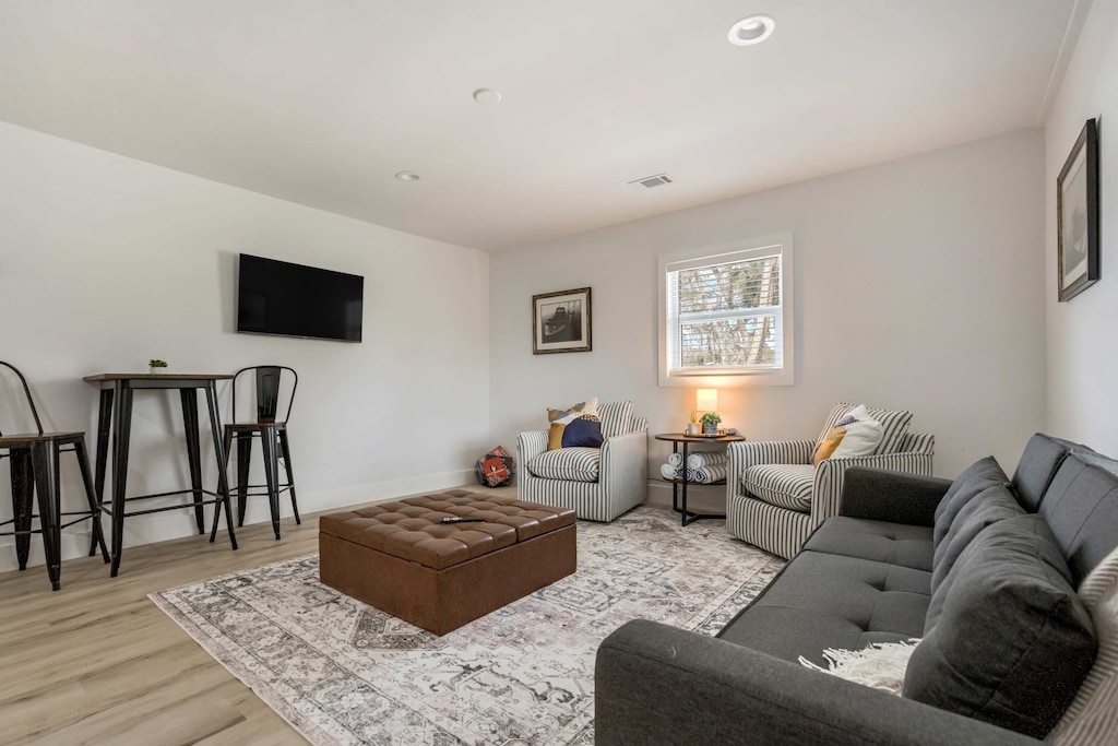 Relax in the inviting living room featuring plush seating, a Smart TV, and a stylish open layout perfect for unwinding after a day of adventure.





