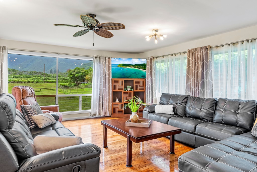 Relax in the bright, airy living room with comfortable seating and windows that frame the island’s natural beauty.