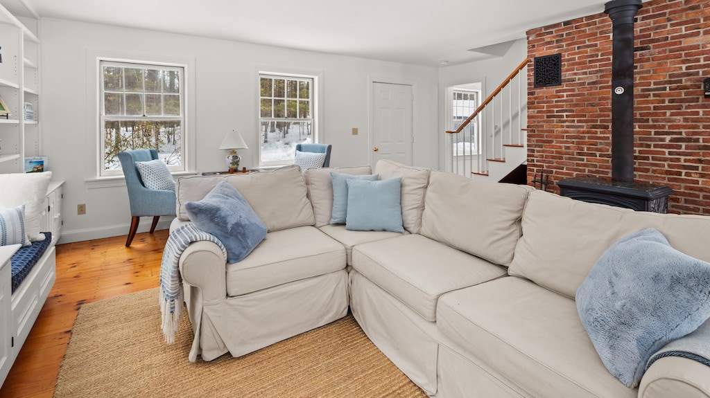 - Bright living room with soft sectional seating   - Natural light fills the space through windows   - Cozy spot to gather after outdoor adventures