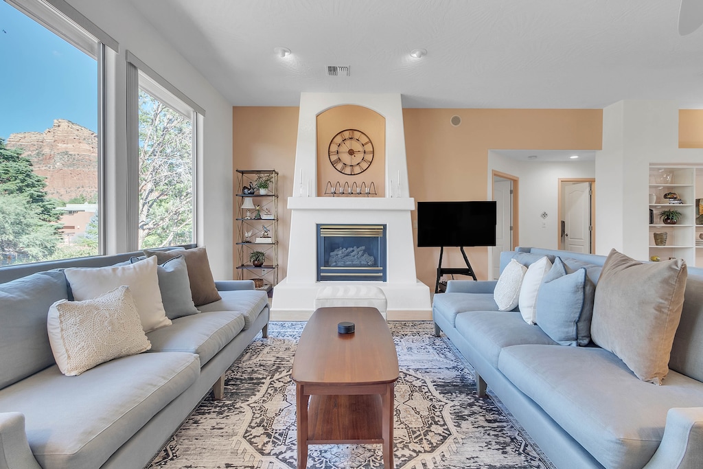 Living room with cozy furnishings,  gas fireplace and a Smart TV