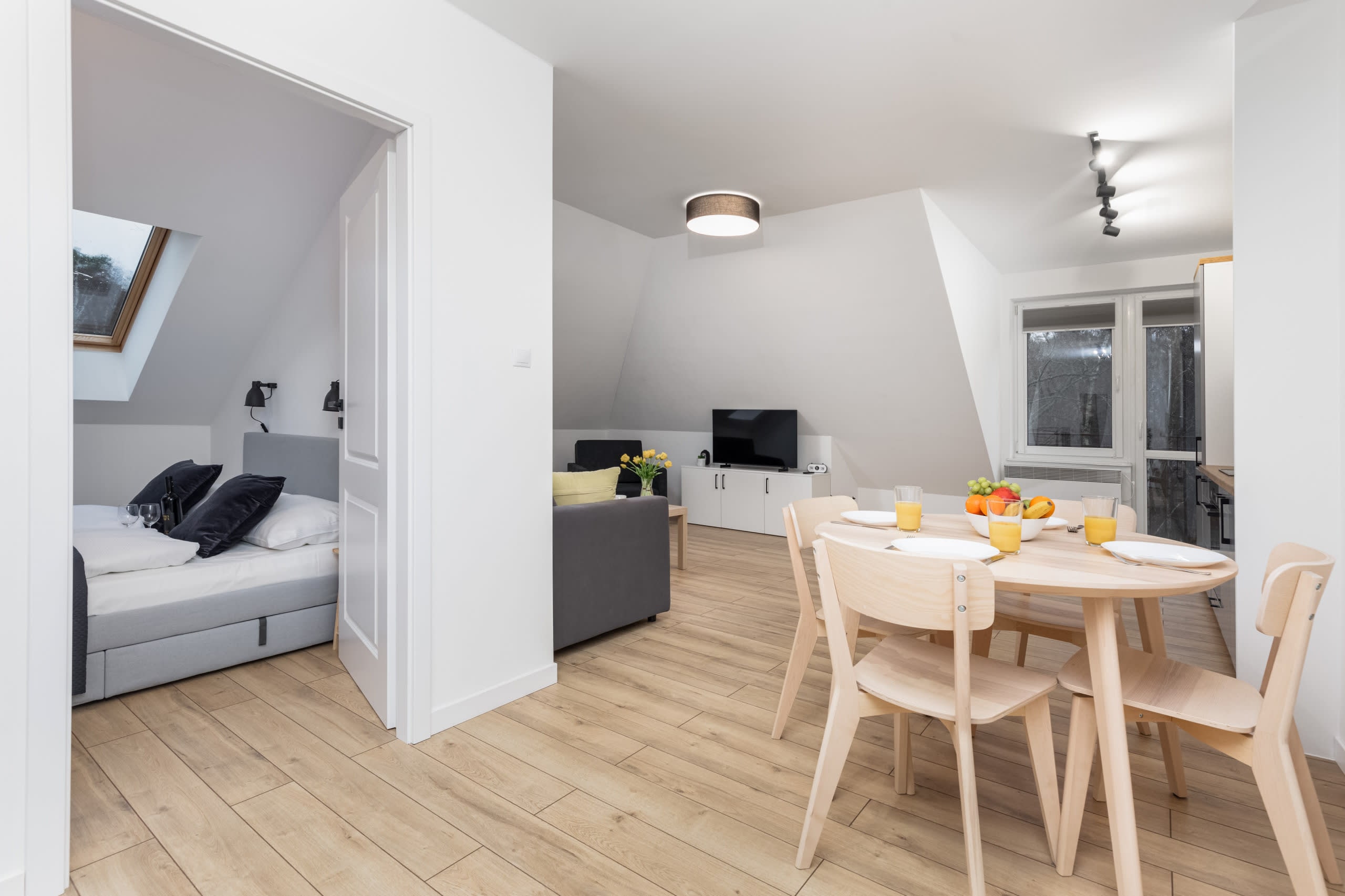 A bright living and dining space, designed for comfort and functionality.

