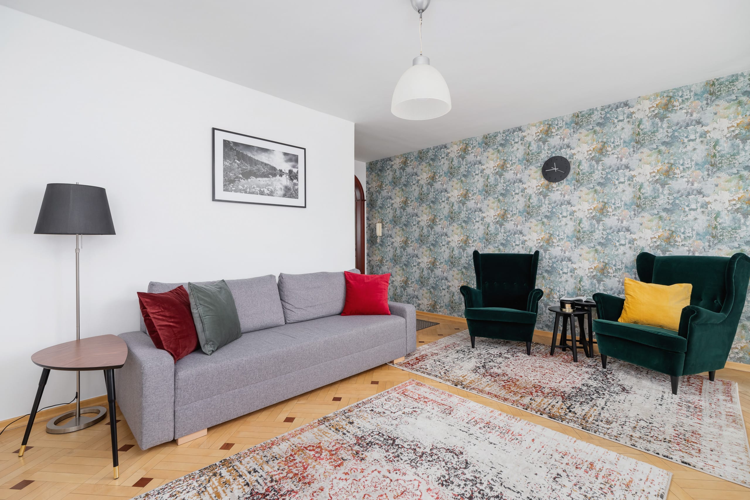 A bright living room with a gray sofa, colorful cushions, and a stylish yellow chair.
A bright living room with a gray sofa, colorful cushions, and a stylish yellow chair.