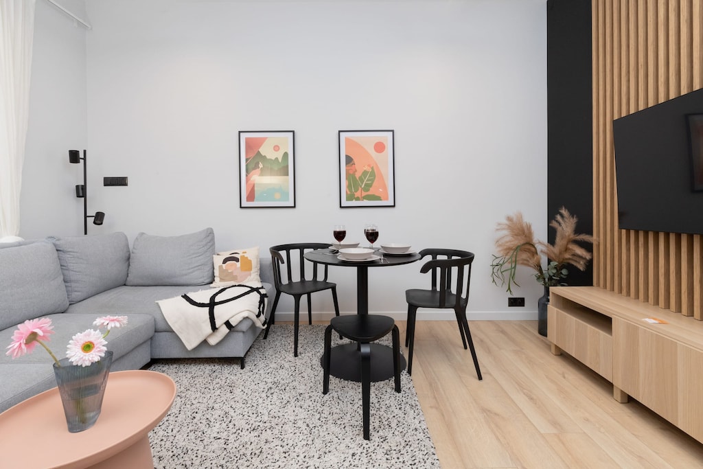 Living room with a comfortable sofa and TV. 