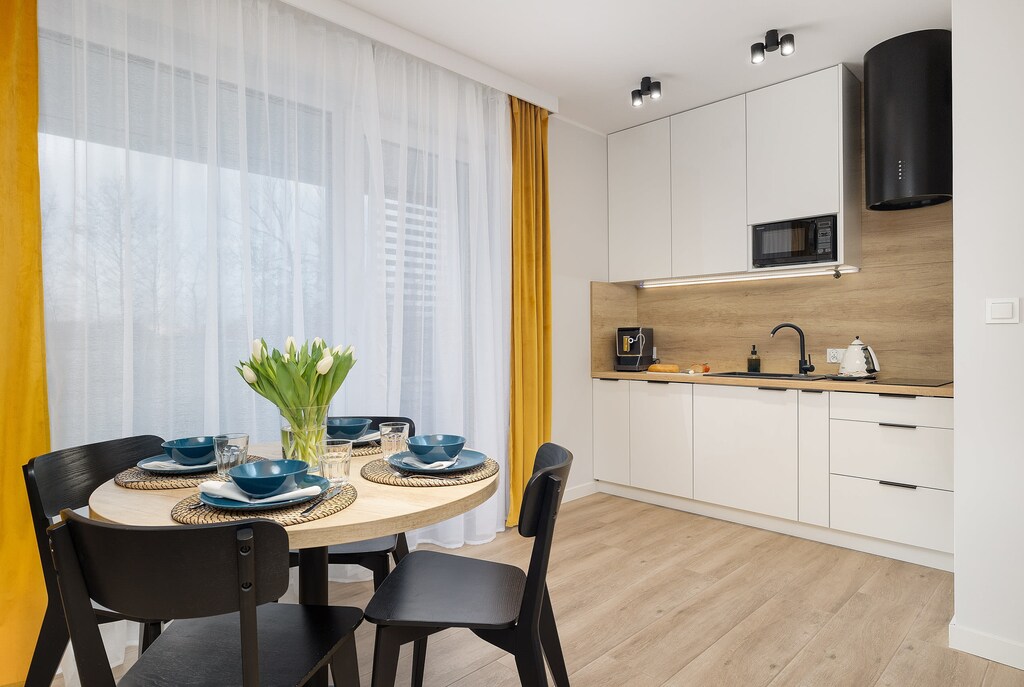 A coherent combination is one round table with a kitchenette.