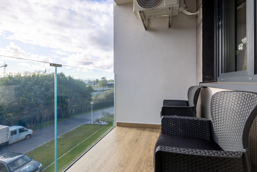 Balcony with furniture that will provide comfort when spending time outdoors.