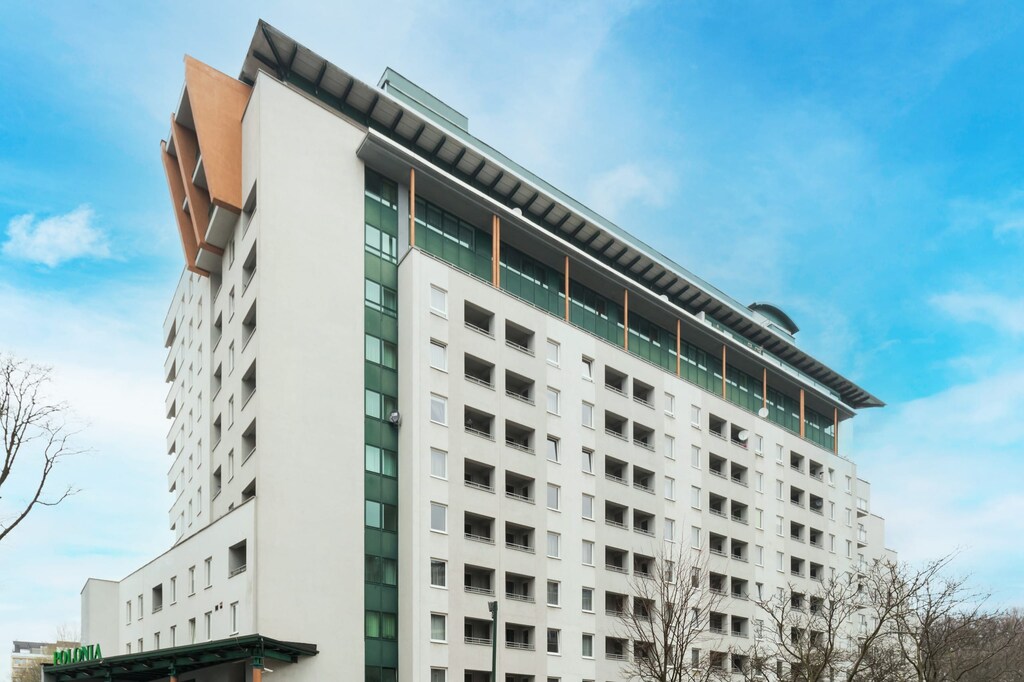 An exterior view of a contemporary residential building with unique architectural design.

