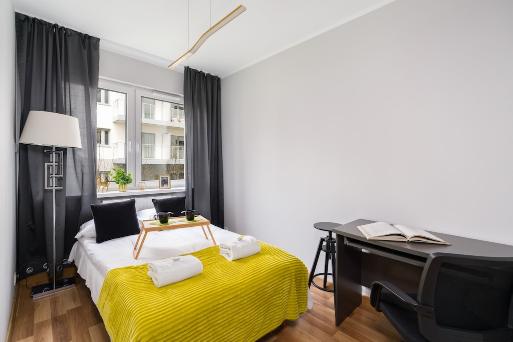 The cosy bedroom features a luxurious double sofa bed and ample storage.