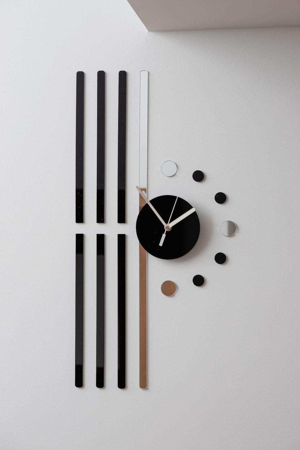 A close-up of a decorative wall clock, adding a contemporary touch to the interior.
