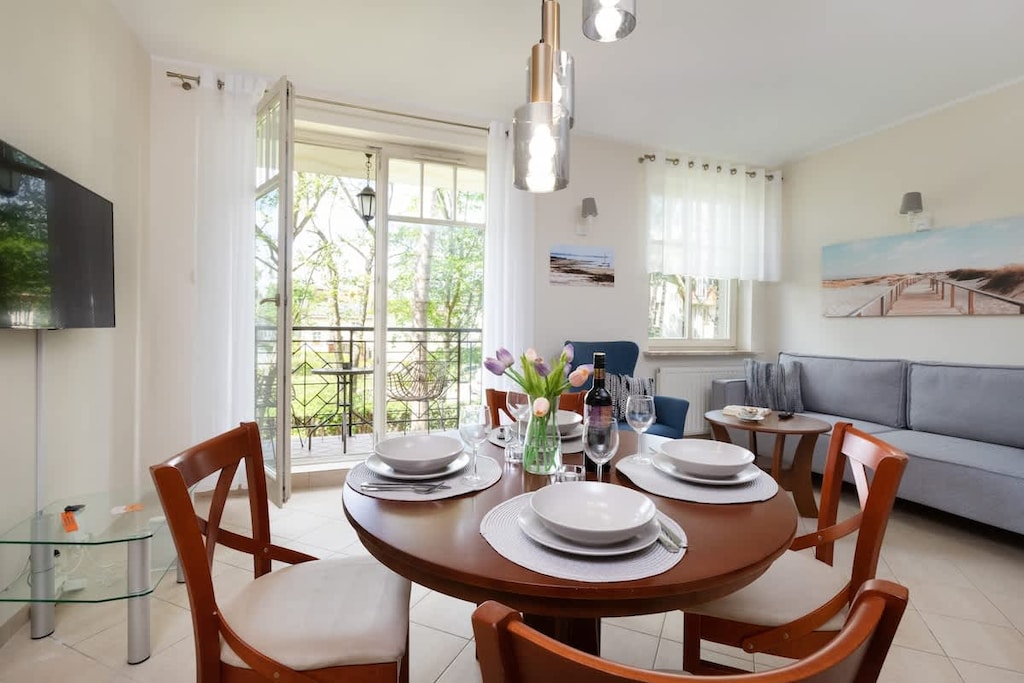 Large table with chairs for eating communal meals. 
