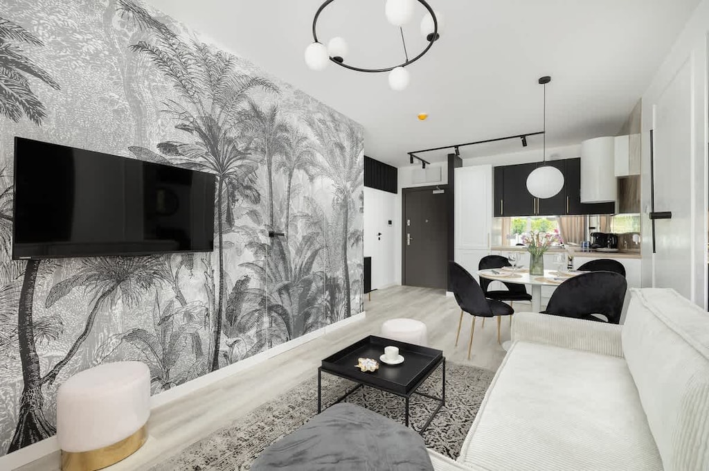 Relax in the stylish living room with a comfortable sofa and modern decor.