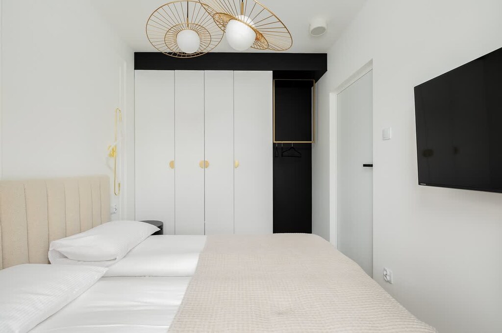 The bedroom's elegant decor creates a serene and restful environment.