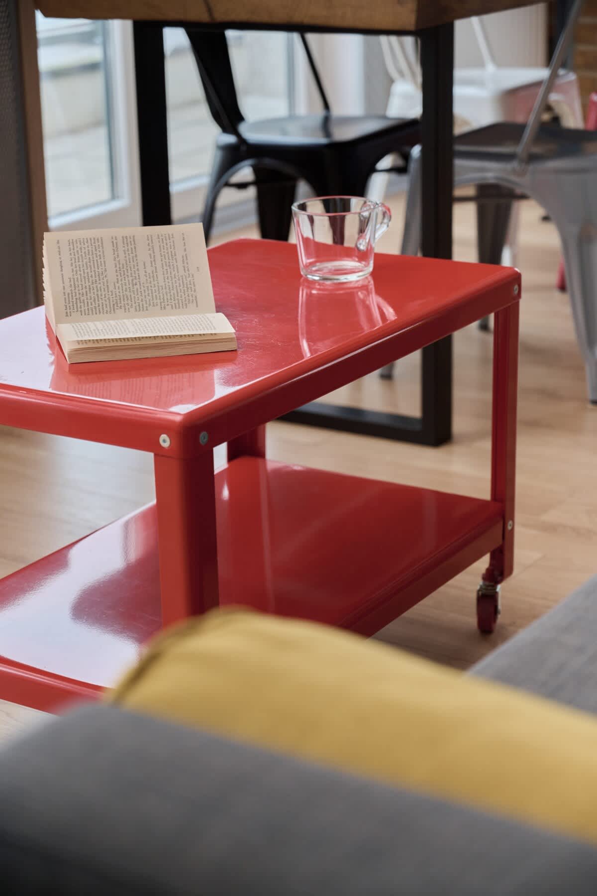 A vibrant red coffee table adding a bold accent to the minimalist interior design.

