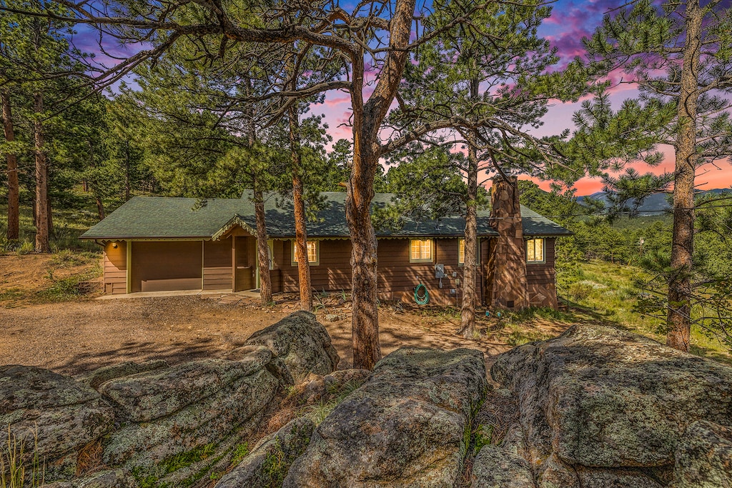 Kittery West Estes Park, Exterior of home, at twilight.