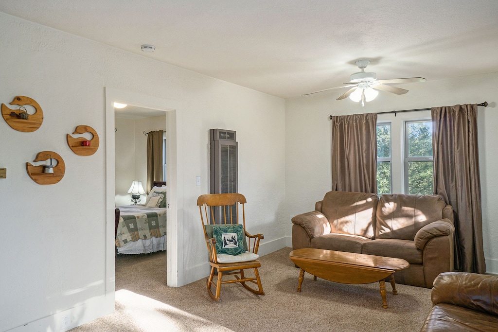 O'Deer Cabin Estes Park, Living room with a couch, loveseat and rocking chair.