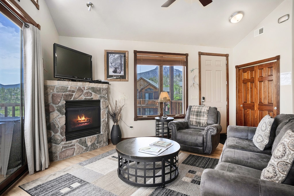 Enter into your gorgeous living room which includes sofa for 3, comfy side chair, gas fireplace and flat screen TV.