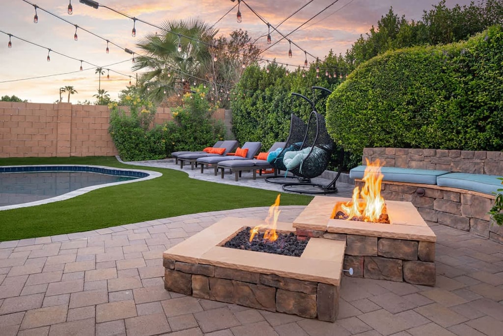 Fire pit for those chilly nights. Plenty of lounge chairs to take in the sun and a heated pool - Heat is extra per day.