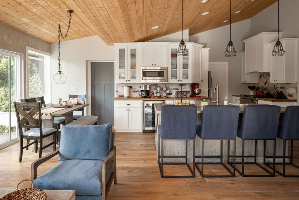 Amazing tongue and grove  wood ceilings throughout the kitchen and living room/Dining room. This home has a warm, charming vibe throughout!
