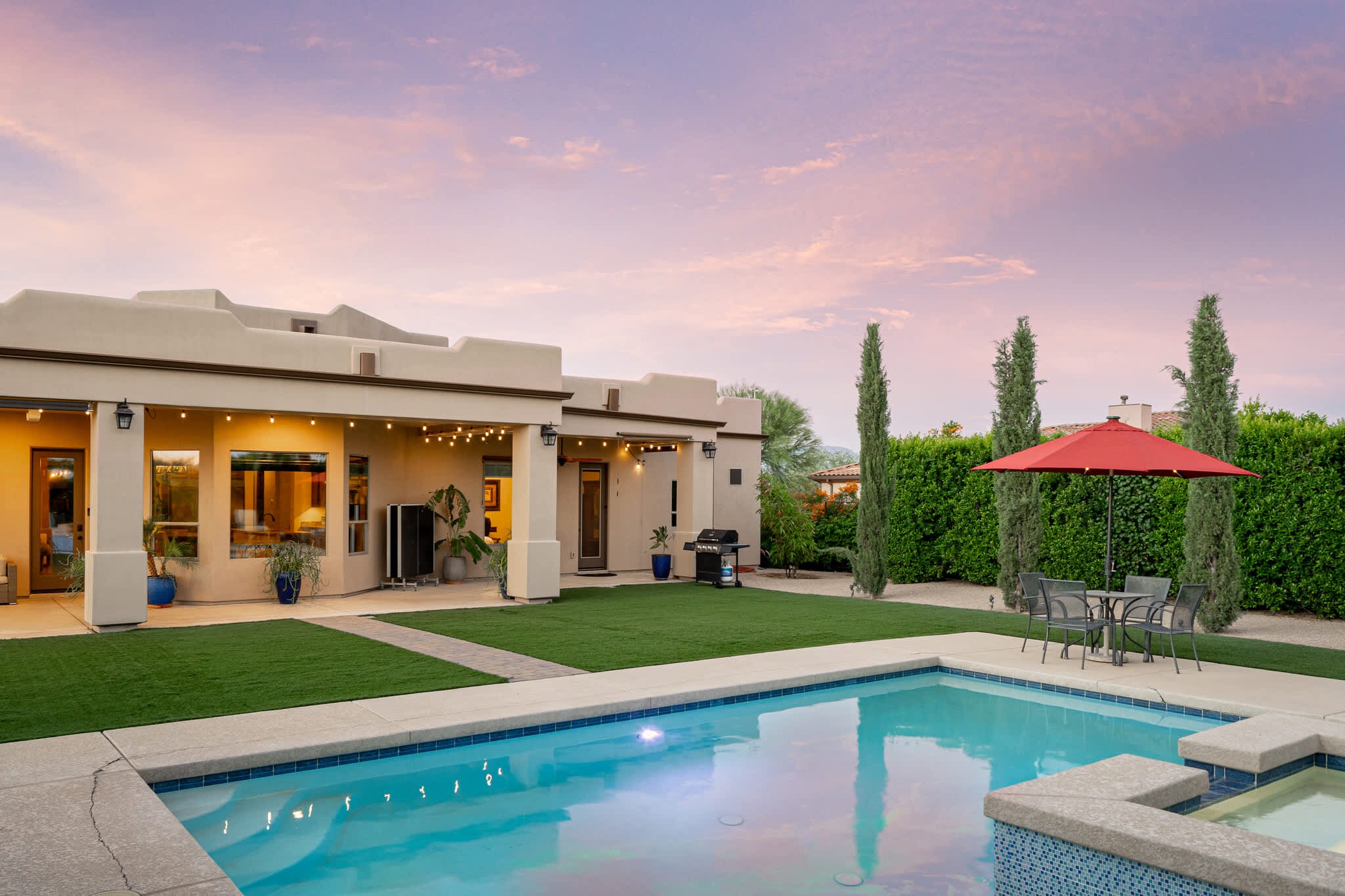 Vibrant poolside living with a stunning sunset backdrop.