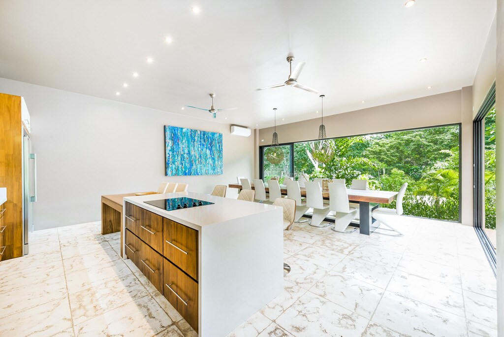 Big glass doors wide open to the jungle vibes.